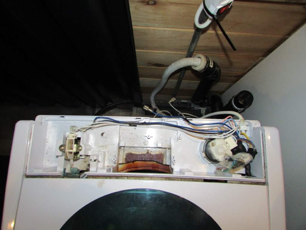 Washing machine with rear panel removed.