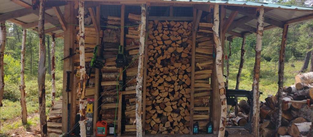 Another view of a full woodshed.